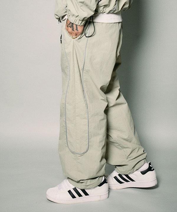 SUBCIETY サブサエティ Reflective piping nylon pants